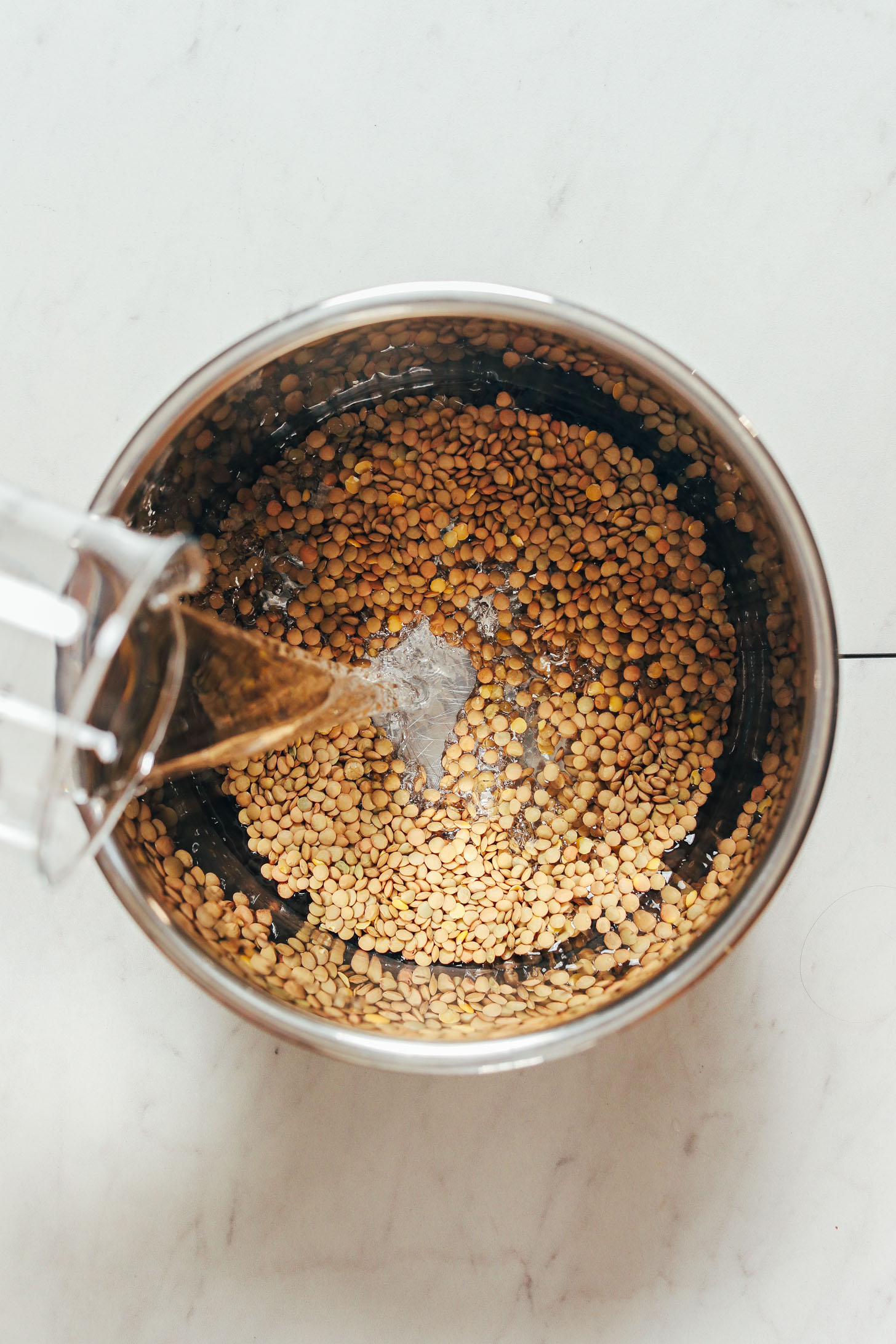 Pouring water over dry lentils