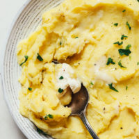 Vintage spoon in a bowl of Instant Pot mashed potatoes