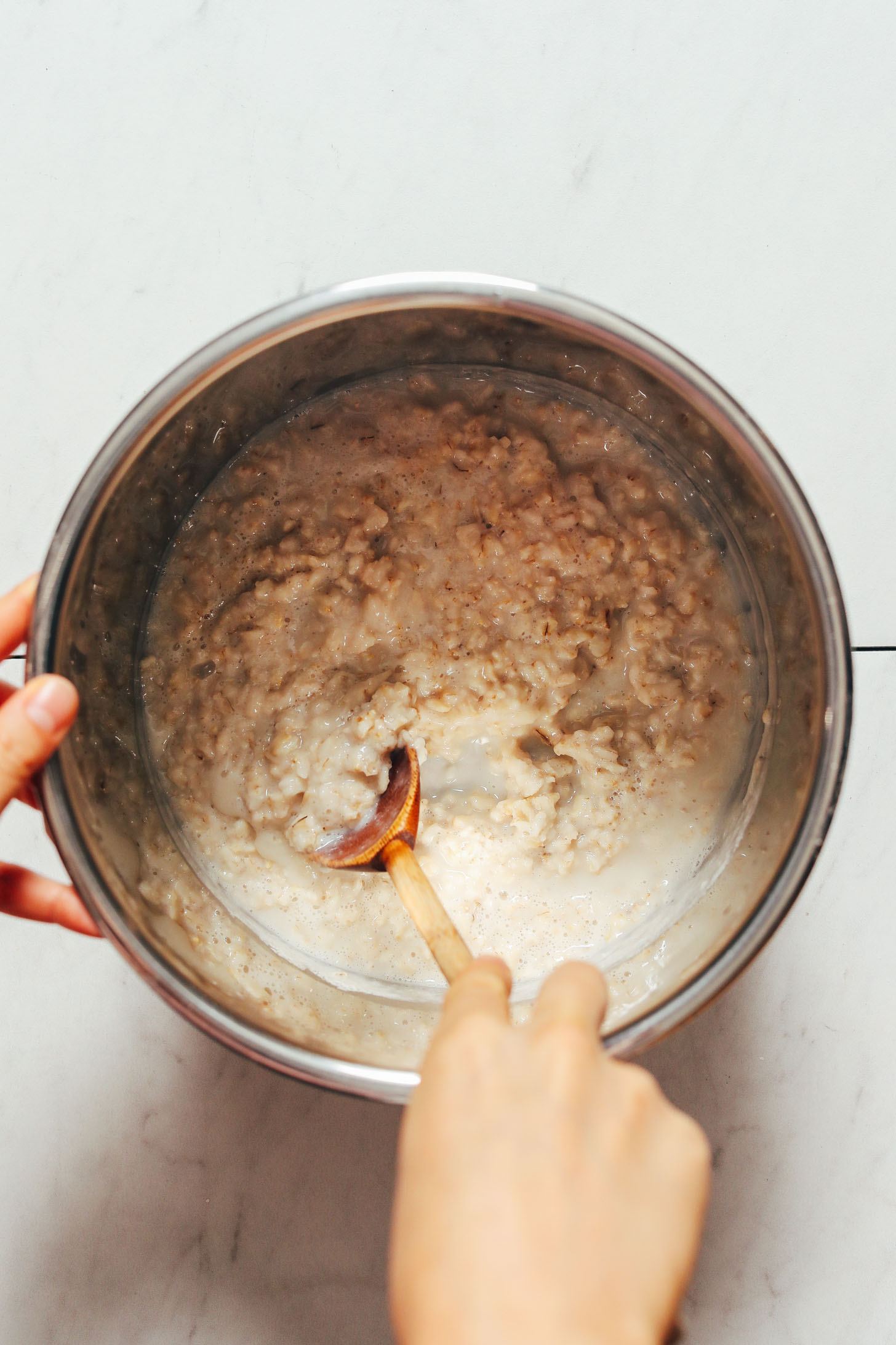 Stirring cooked oats in the Instant Pot