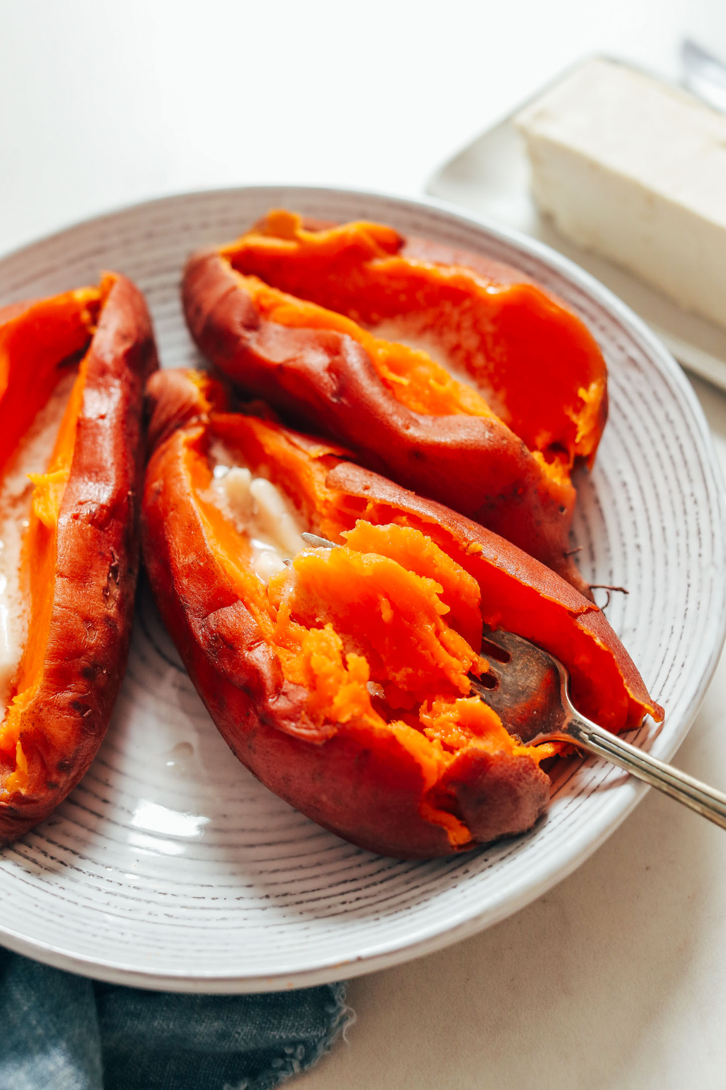 Fork in a perfectly tender sweet potato cooked in the Instant Pot
