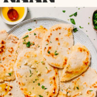 Plate of our fluffy gluten-free naan with text above it saying yeast-free and ready in 20 minutes