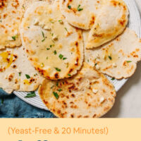 Pieces of fluffy vegan gluten-free naan on a plate