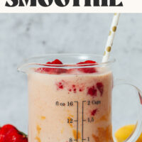 Measuring glass filled with our vegan and gluten-free peanut butter and jelly smoothie recipe