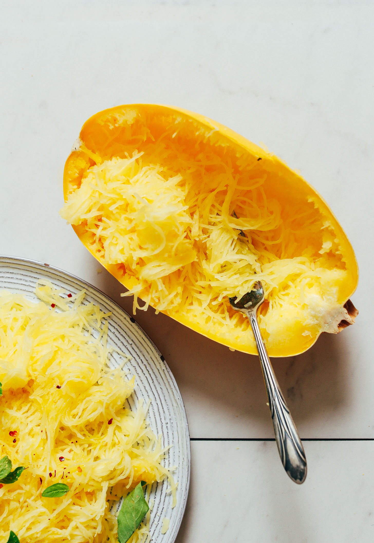 Instant Pot spaghetti squash on a plate and in the squash skin