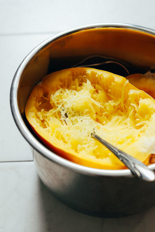 Fork in cooked spaghetti squash in the Instant Pot