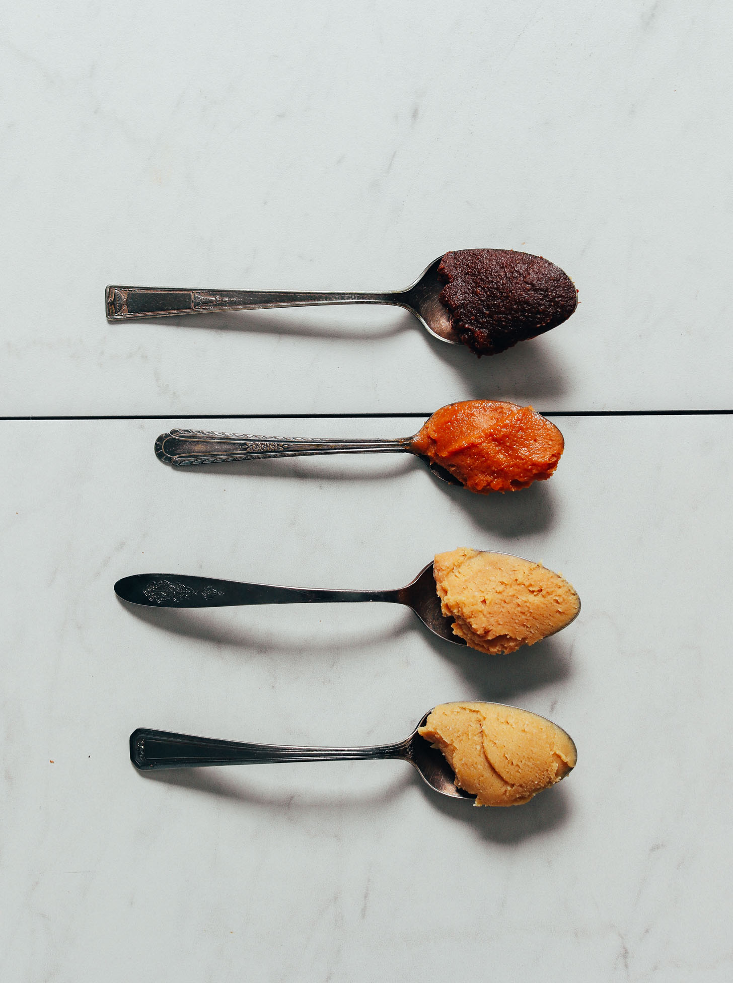 Spoonfuls of different types of miso paste