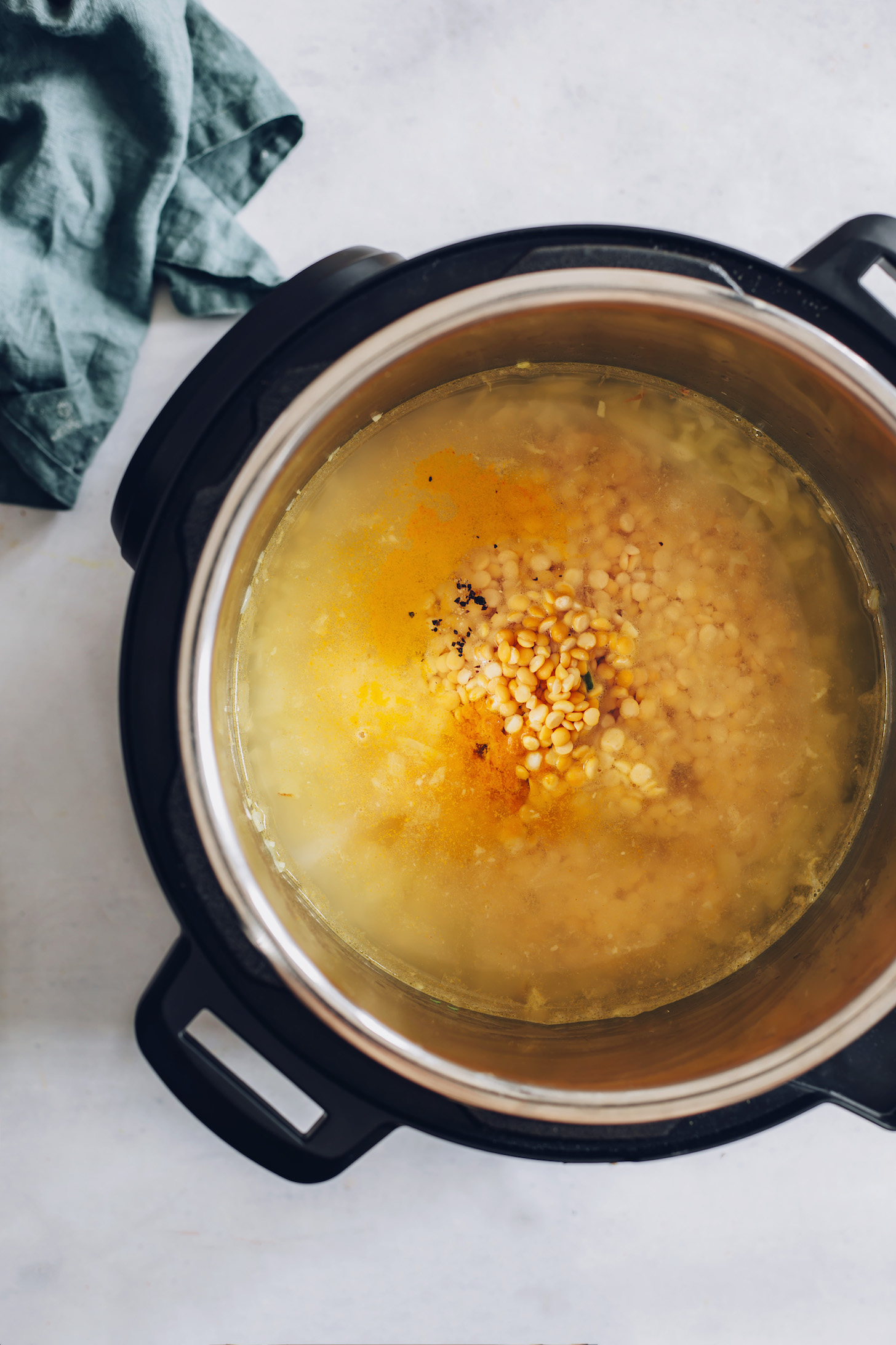 Instant Pot of yellow split peas, water, broth, and spices