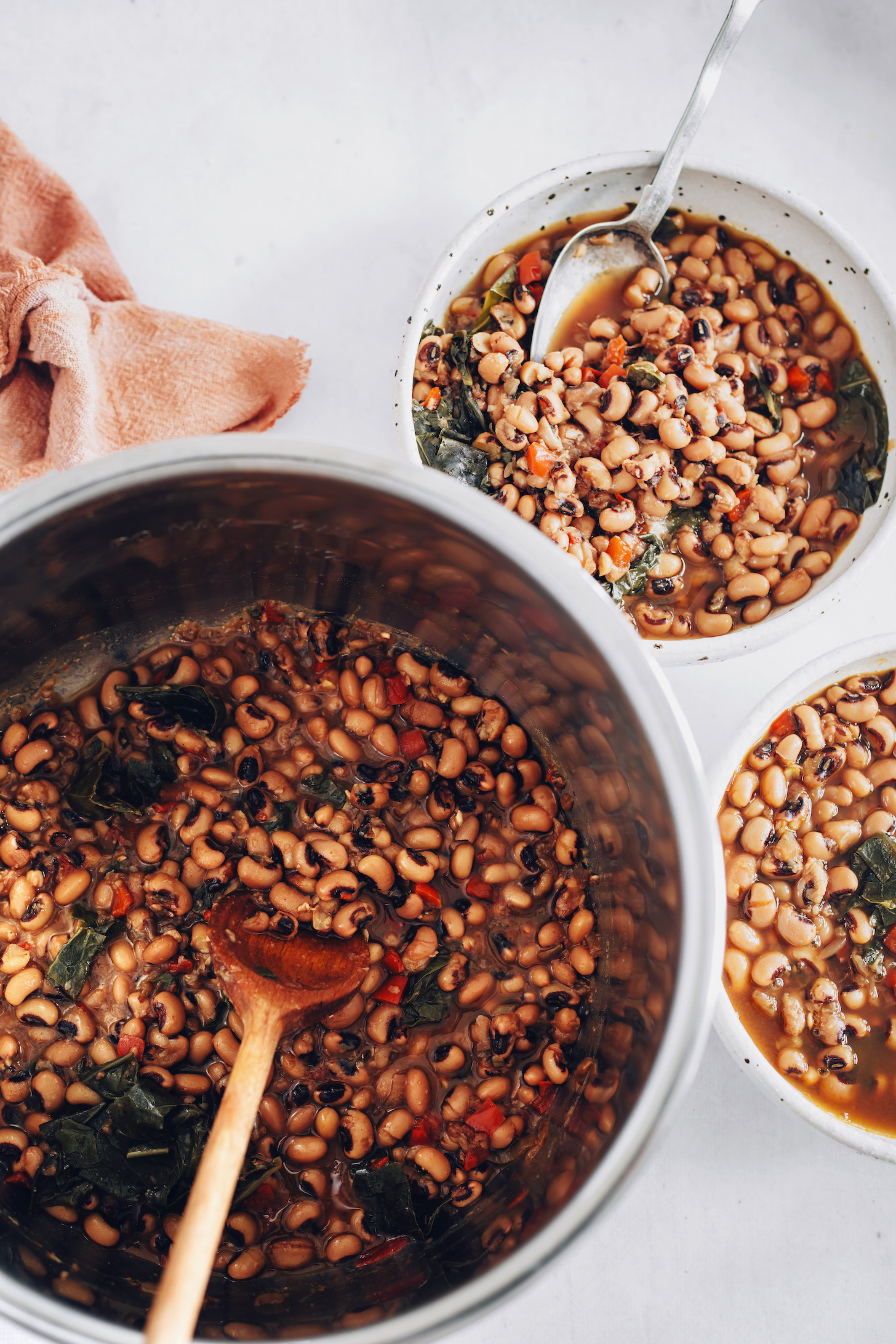Instant Pot and bowls of vegan black eyed peas and greens
