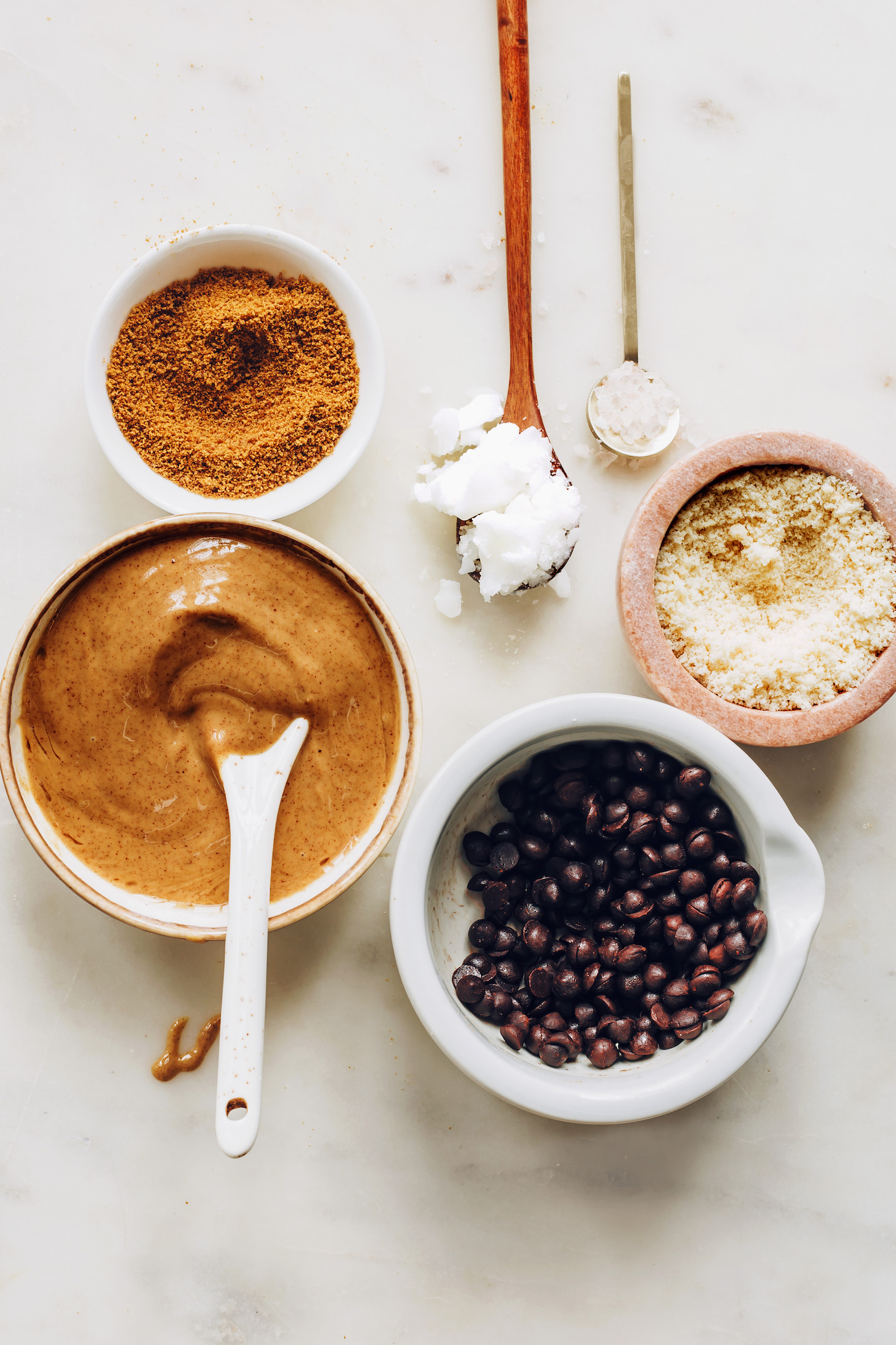 Coconut sugar, peanut butter, coconut oil, chocolate chips, almond flour, and sea salt