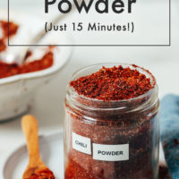 Spoon and jar of homemade chili powder