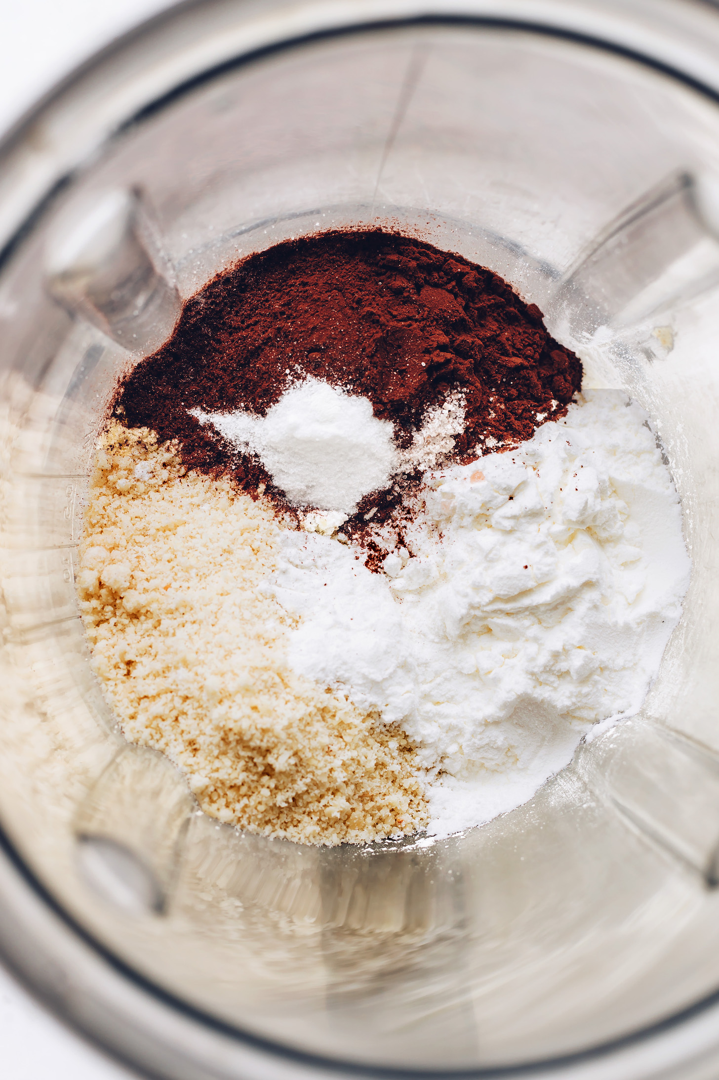 Almond flour, tapioca starch, cocoa powder, baking soda, and sea salt in a food processor