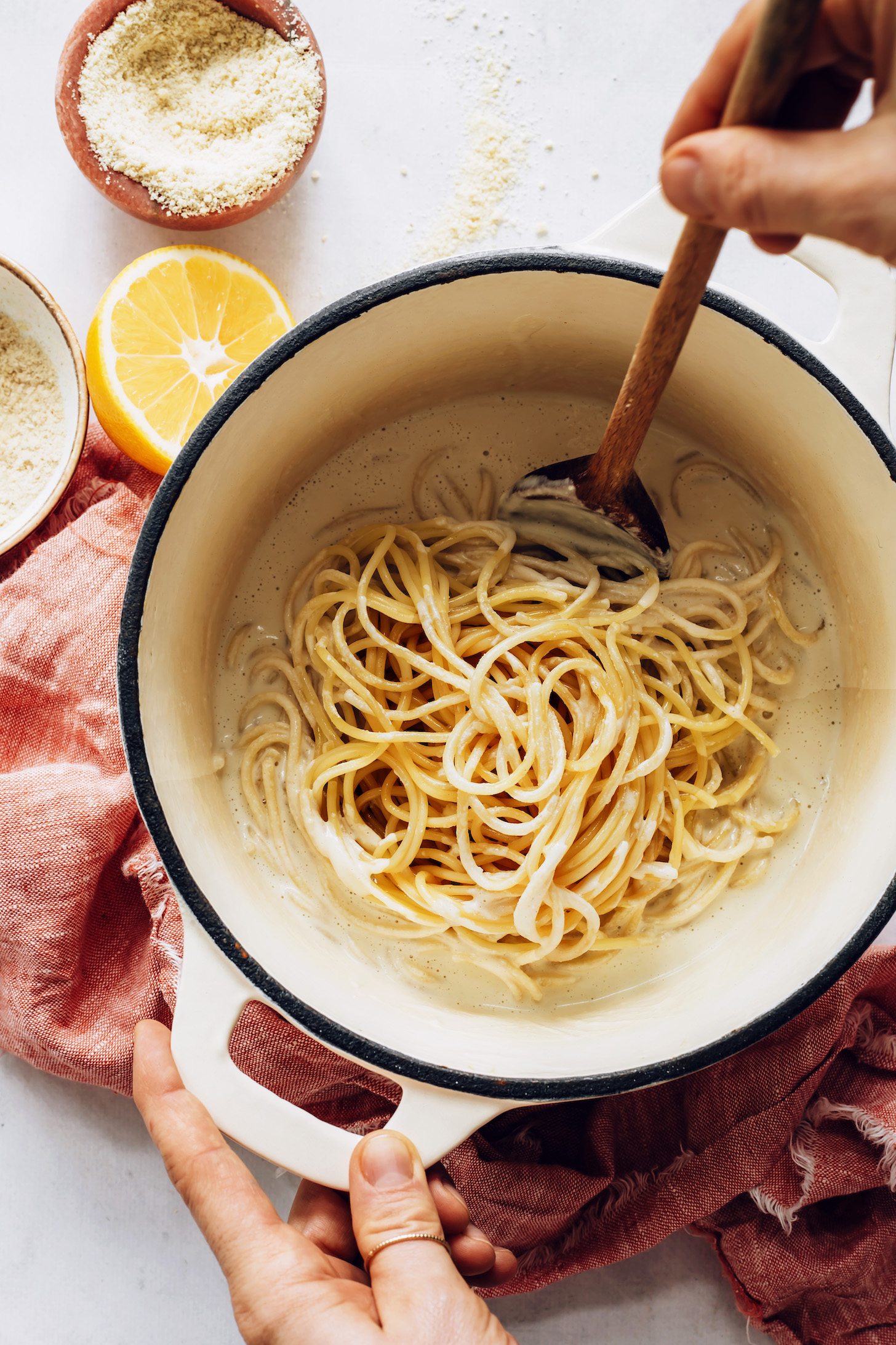 Spaghetti noodles in a pot of pasta al limone sauce