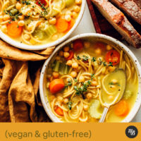 Bowls of vegan chicken noodle soup made with chickpeas