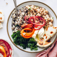 Spring Buddha Bowl with pickled vegetables, quinoa, kale, and white beans