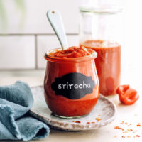 Spoon in a jar of our easy sriracha recipe