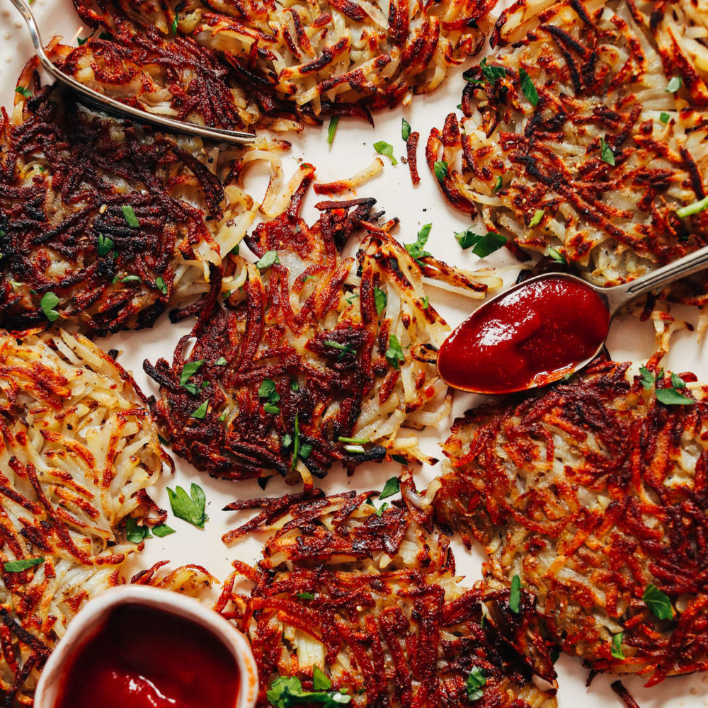 The best homemade hash browns topped with parsley and with a side of ketchup