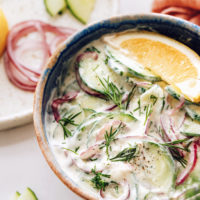 Bowl of our creamy cucumber salad with fresh dill