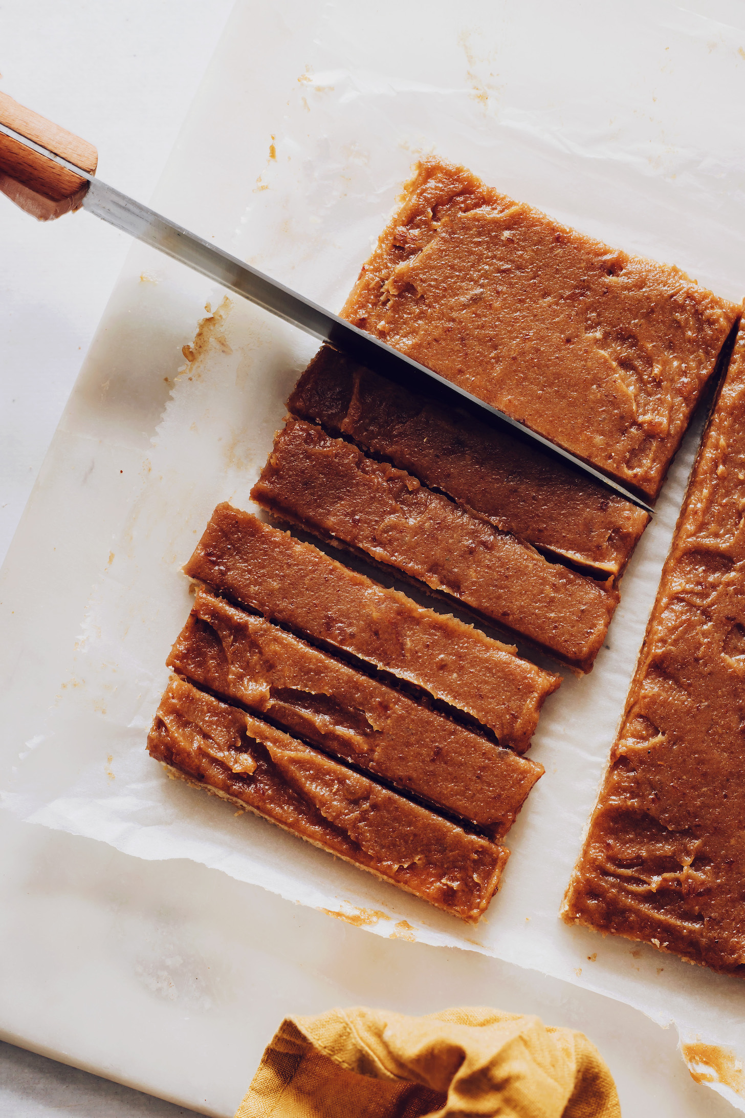Slicing cookie and date caramel bars