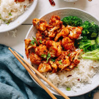 Bowl of General Tso's Cauliflower with rice and broccoli