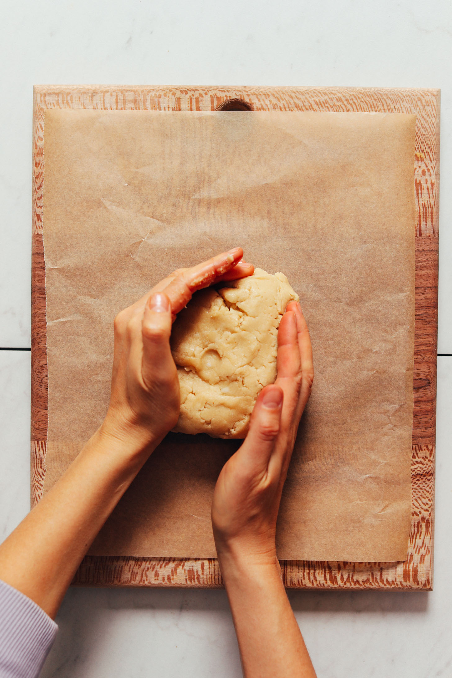 Shaping a ball of gluten-free vegan shortbread cookie dough