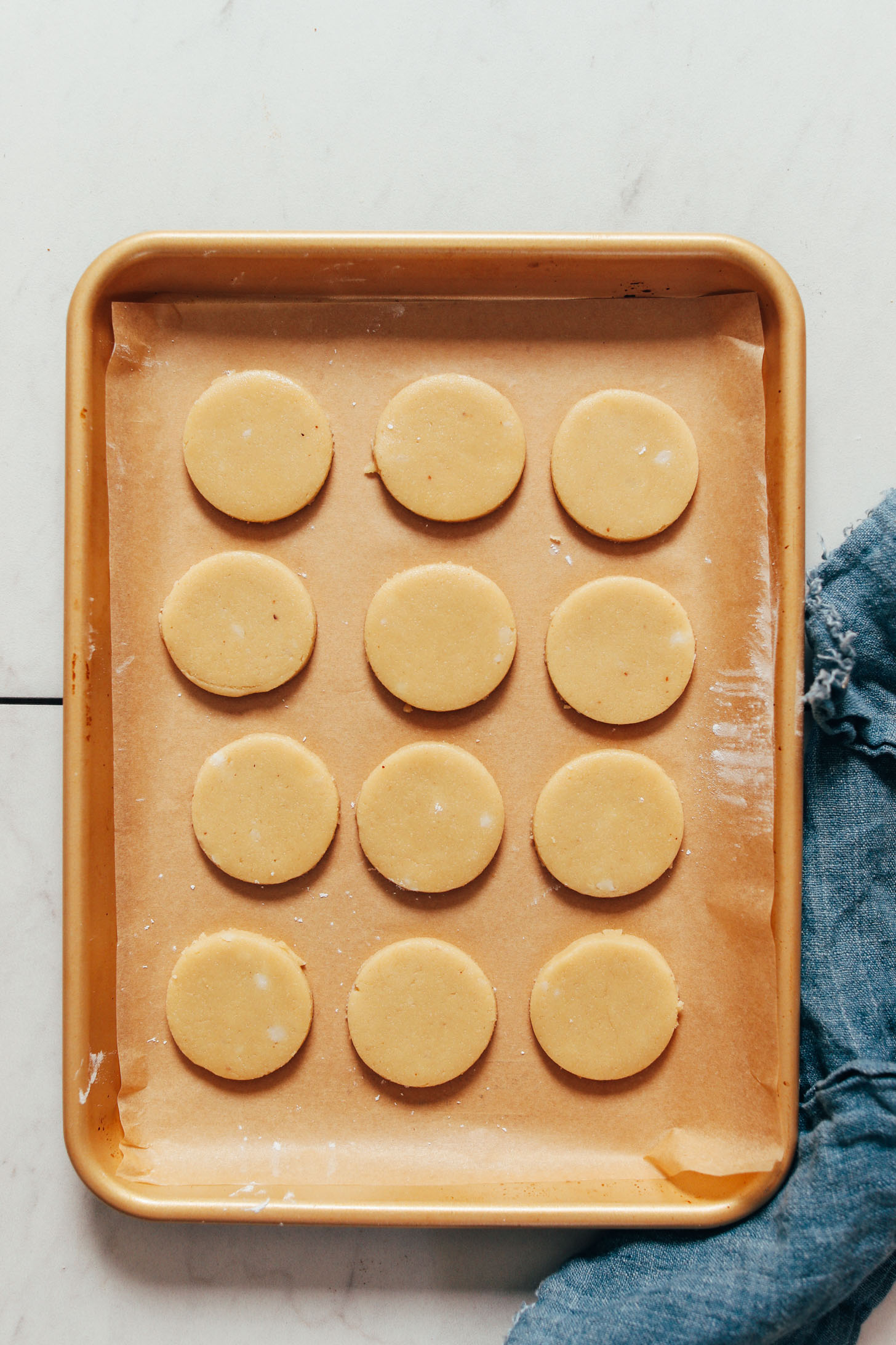Unbaked shortbread cookie dough on a baking sheet