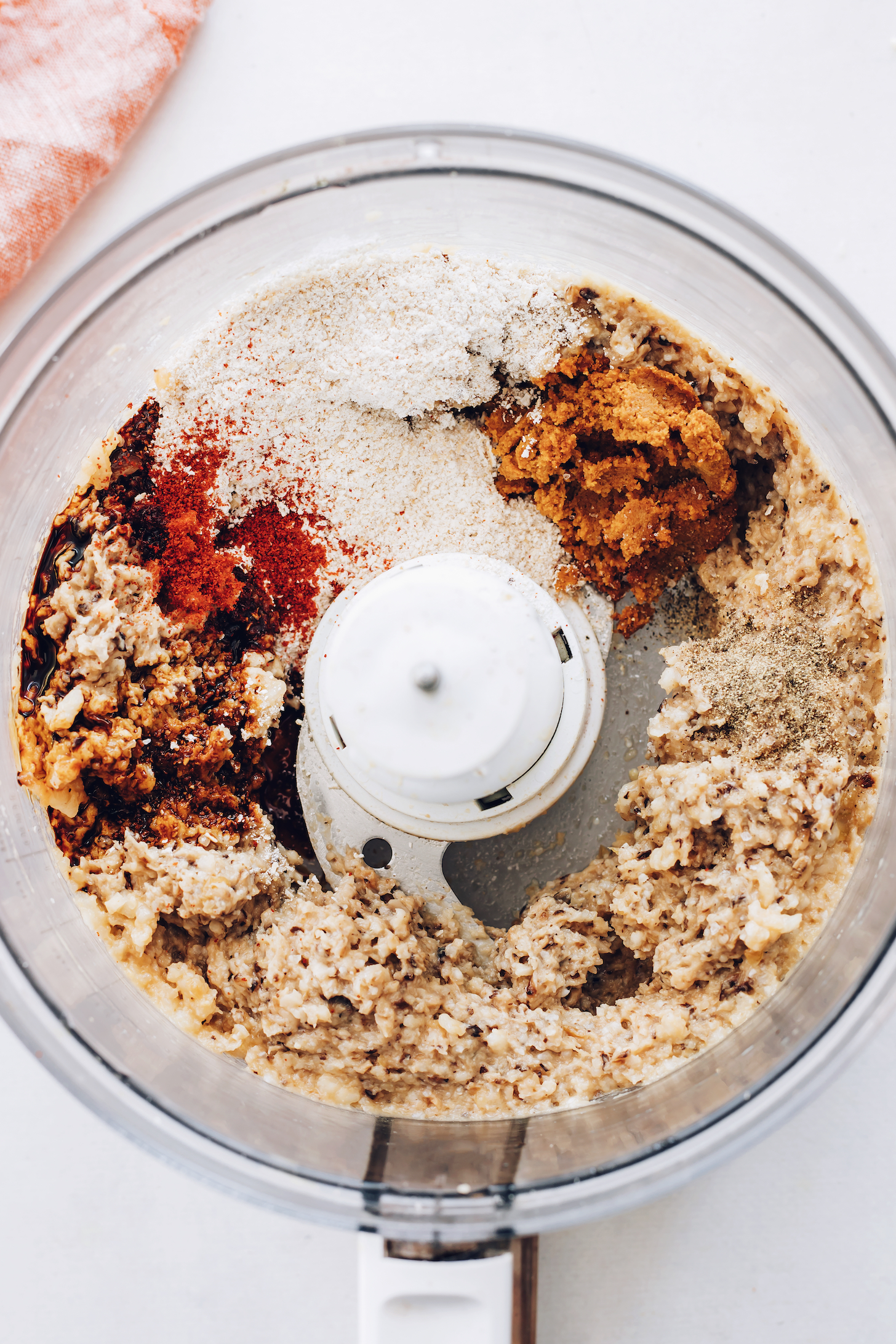 Food processor filled with ingredients for making the best vegan burgers