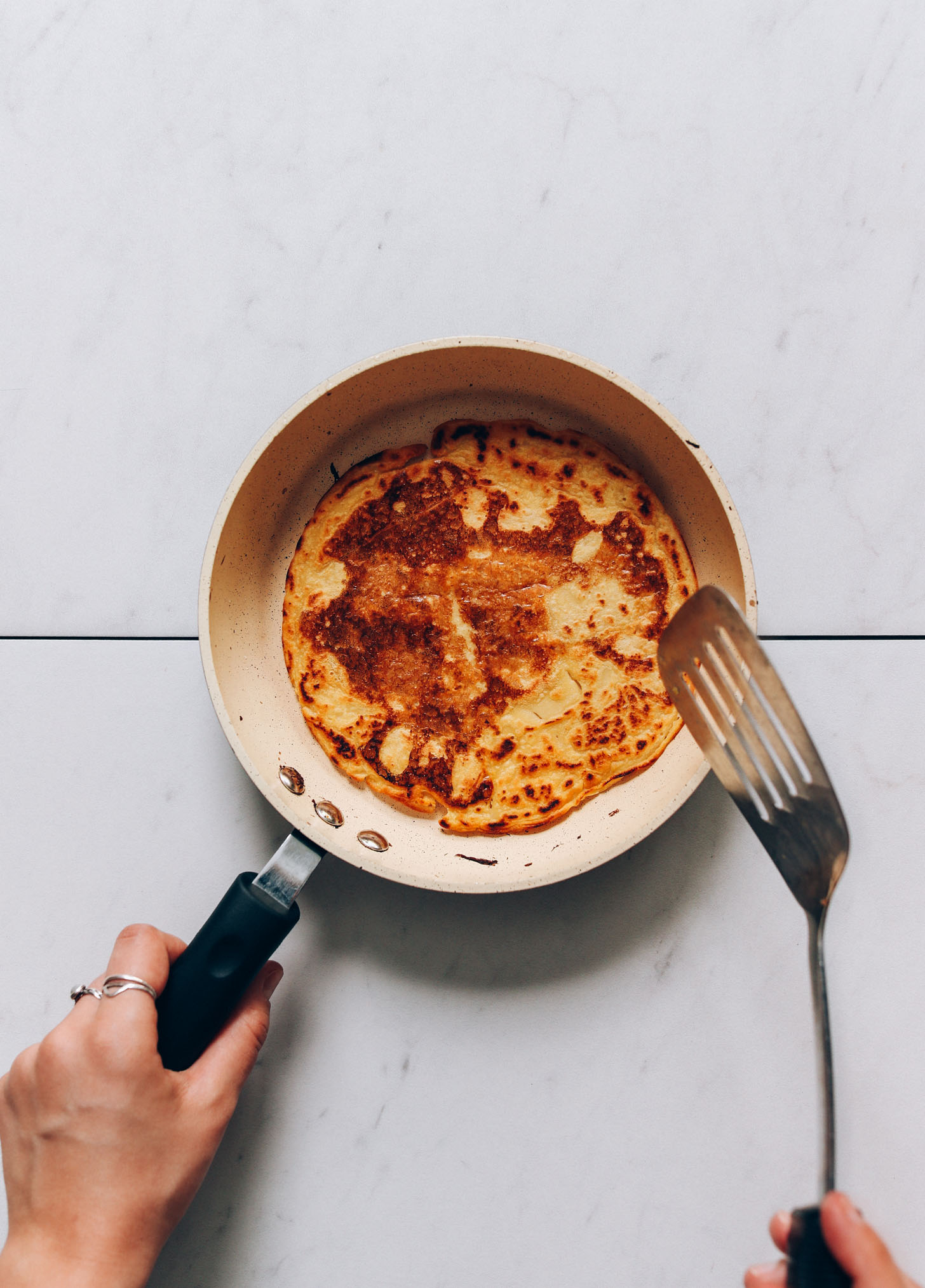Golden brown chickpea pancake in a pan