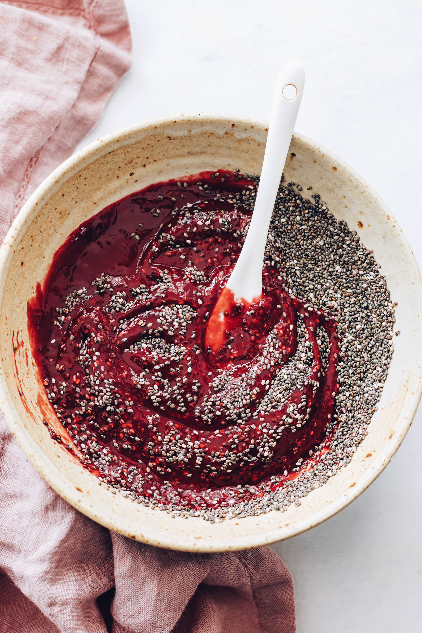 Bowl of chia seeds and raspberry maple purée