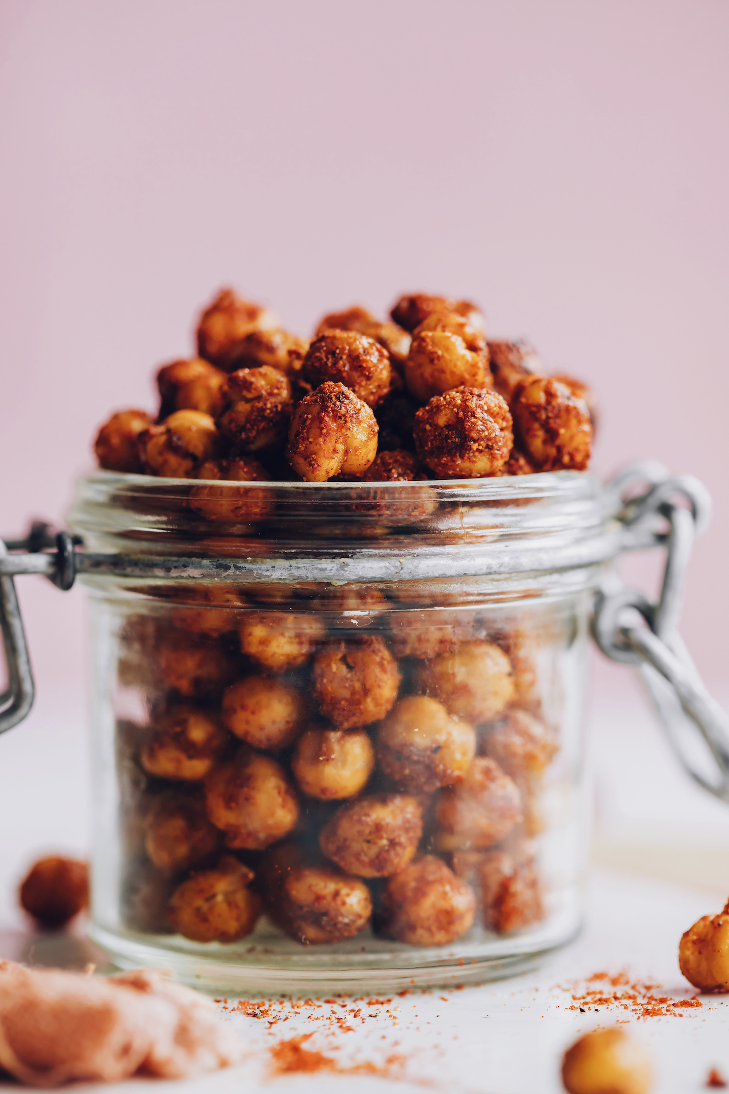 Side view of a jar of crispy oven roasted chickpeas with bbq spices