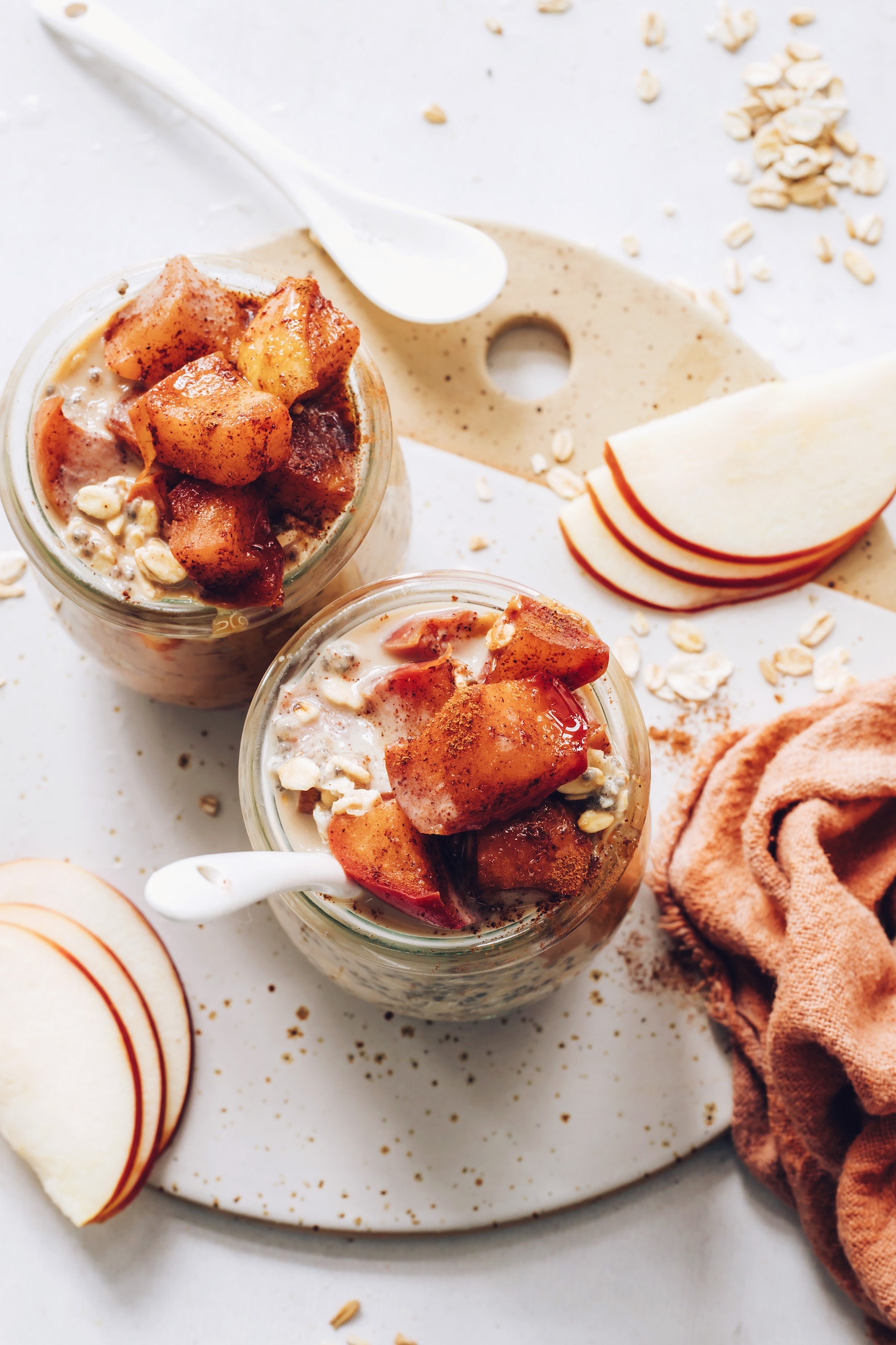 Top down shot of two jars of apple pie overnight oats