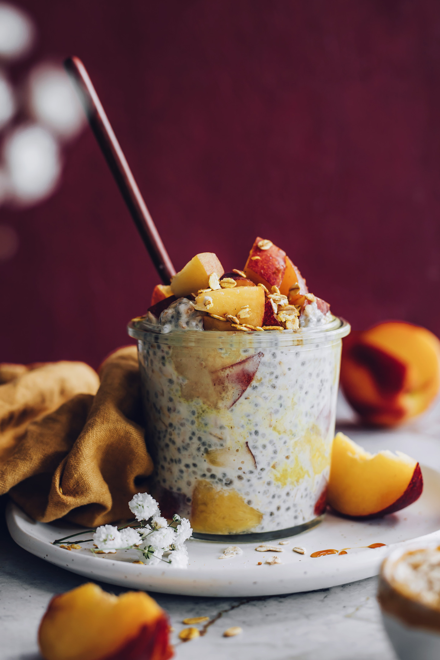 Side view of a jar of peaches and cream overnight oats