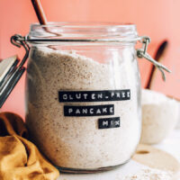 Spoon resting in a jar of vegan gluten-free pancake mix