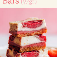 Stack of vegan and gluten-free strawberry cheesecake bars
