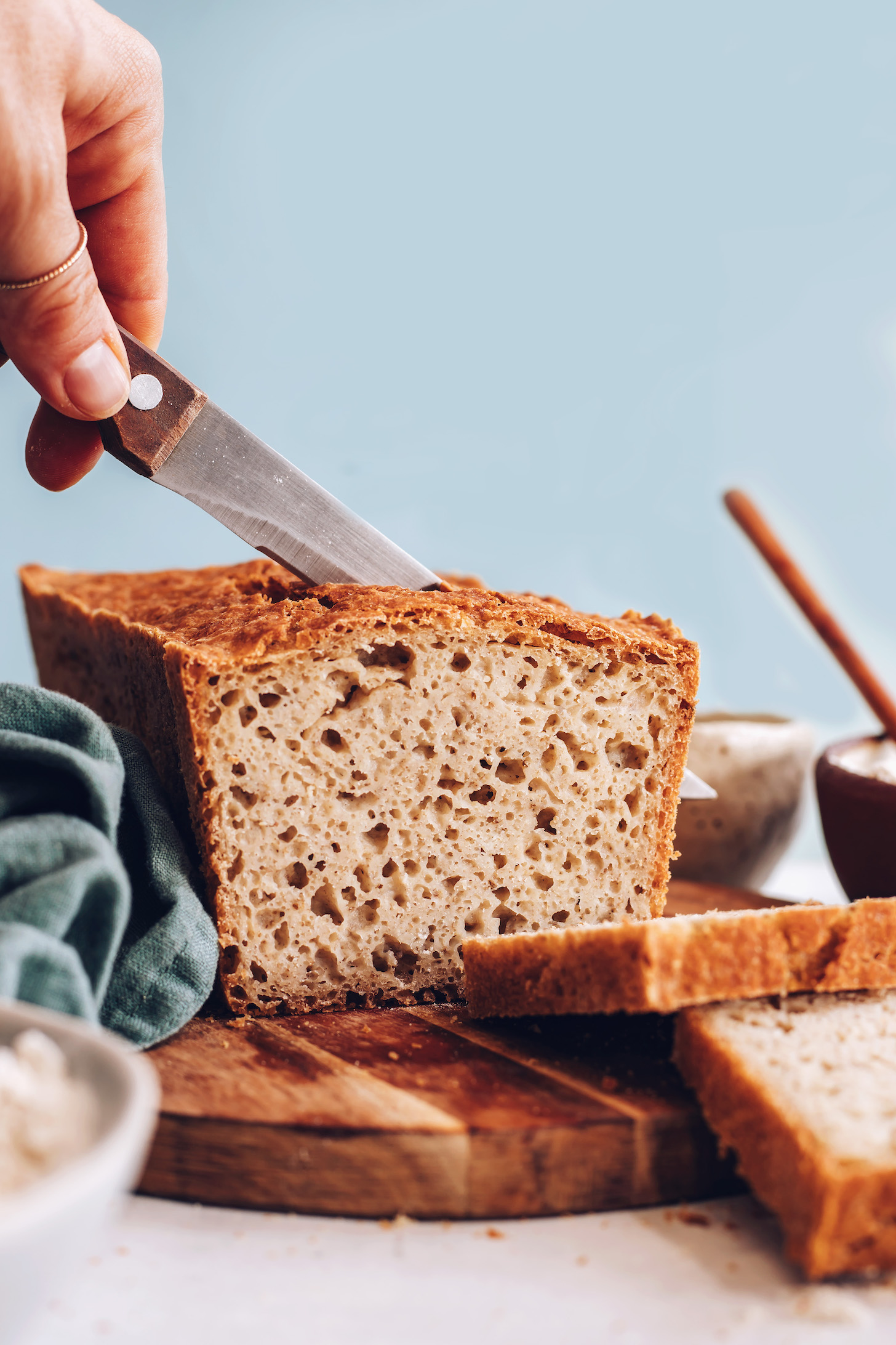 Slicing into a loaf of our gluten-free bread recipe