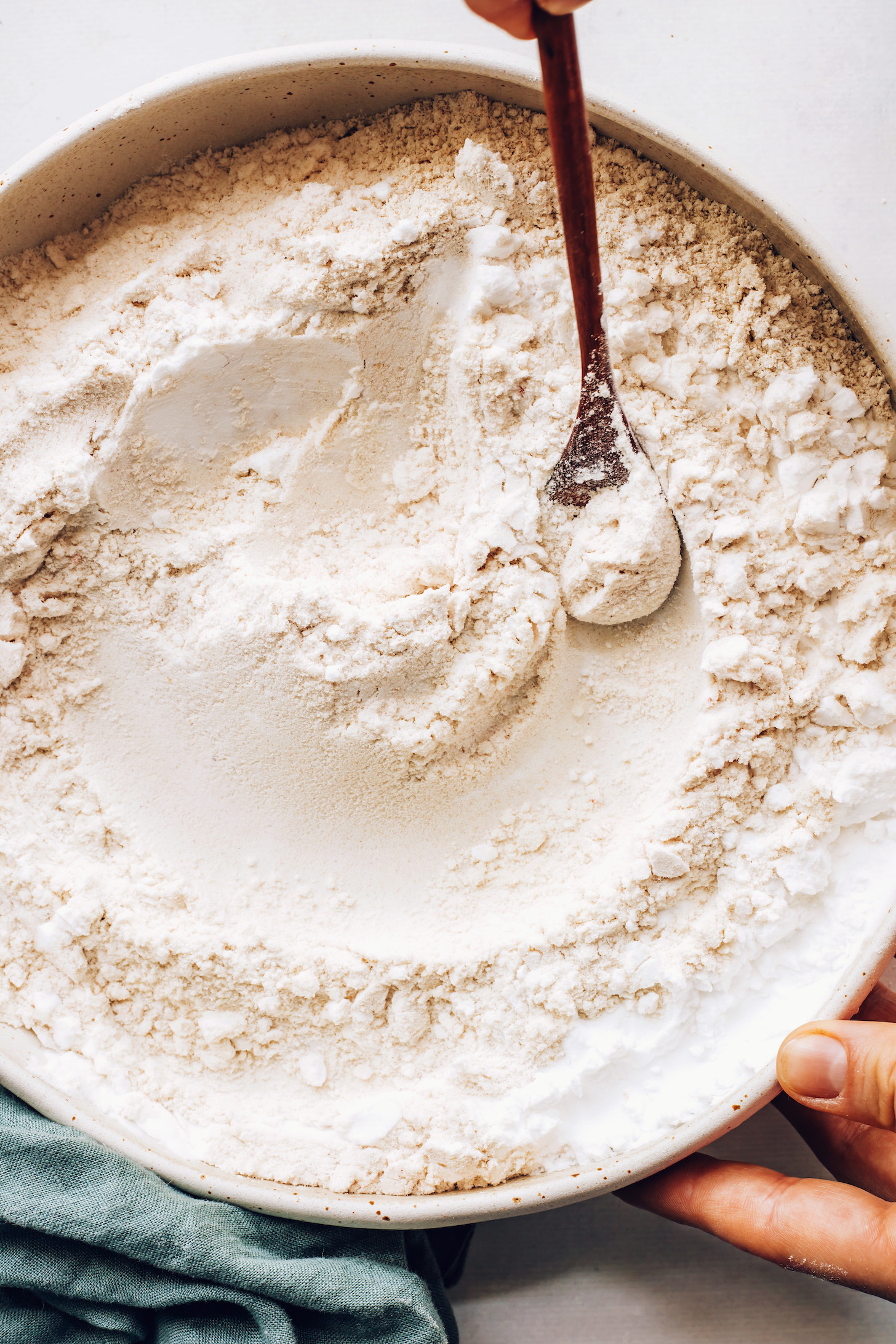 Bowl of brown rice flour, oat flour, sorghum flour, potato starch, and salt