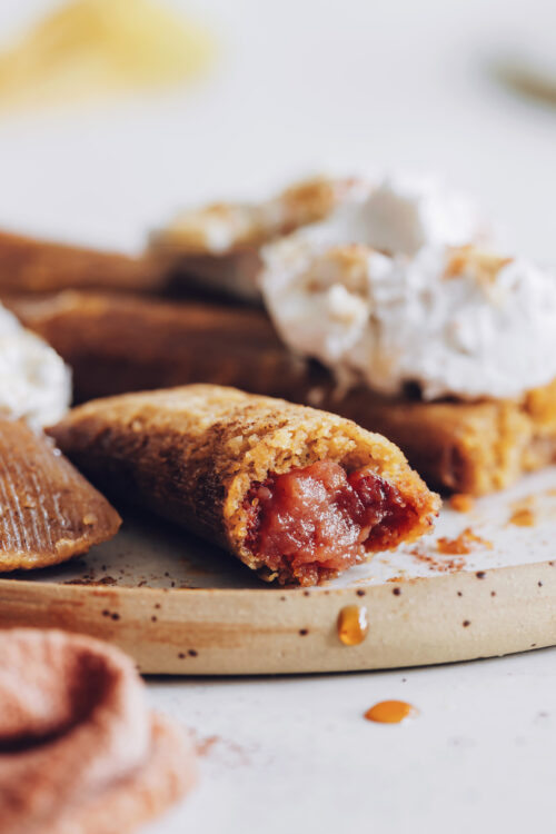 Apple butter dessert tamales topped with coconut whipped cream