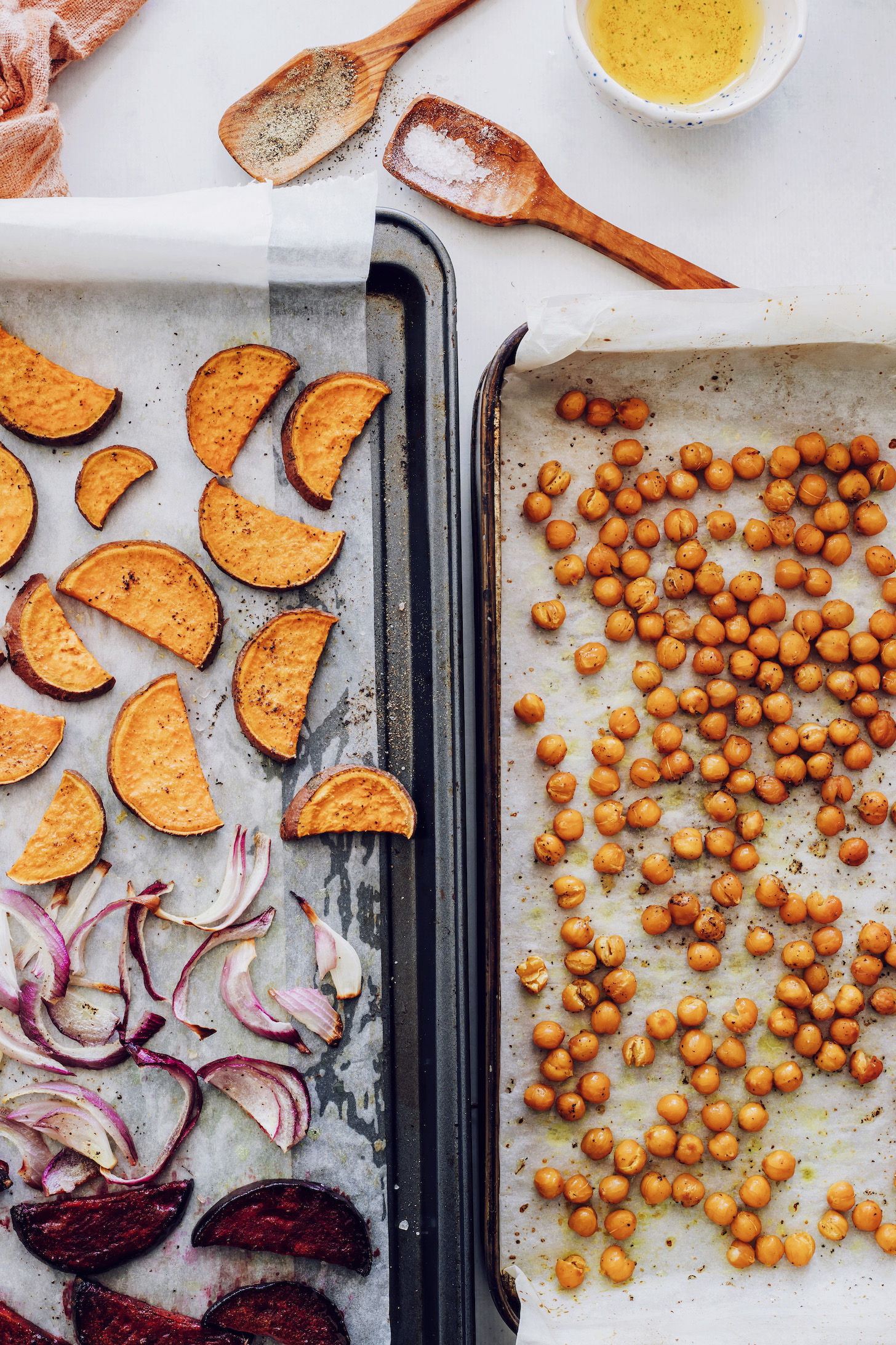 Pans of roasted root vegetables and chickpeas