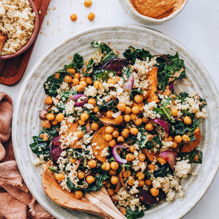 Bowl of hearty kale salad with chipotle pecan pesto