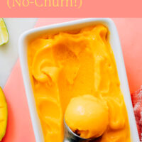 Dish of 3-ingredient mango sorbet with a scoop in it