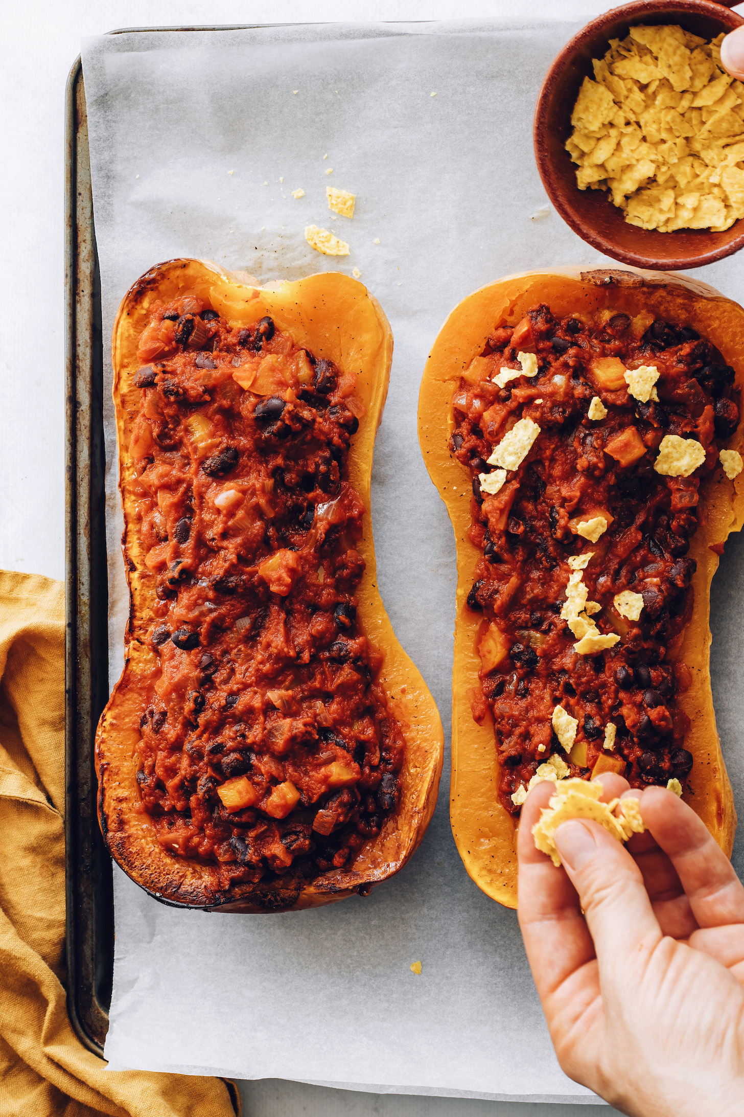 Sprinkling crushed tortilla chips over stuffed squash