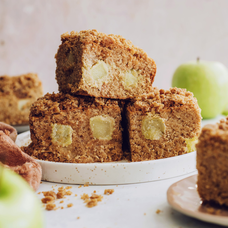Side view of a stack of slices of apple coffee cake