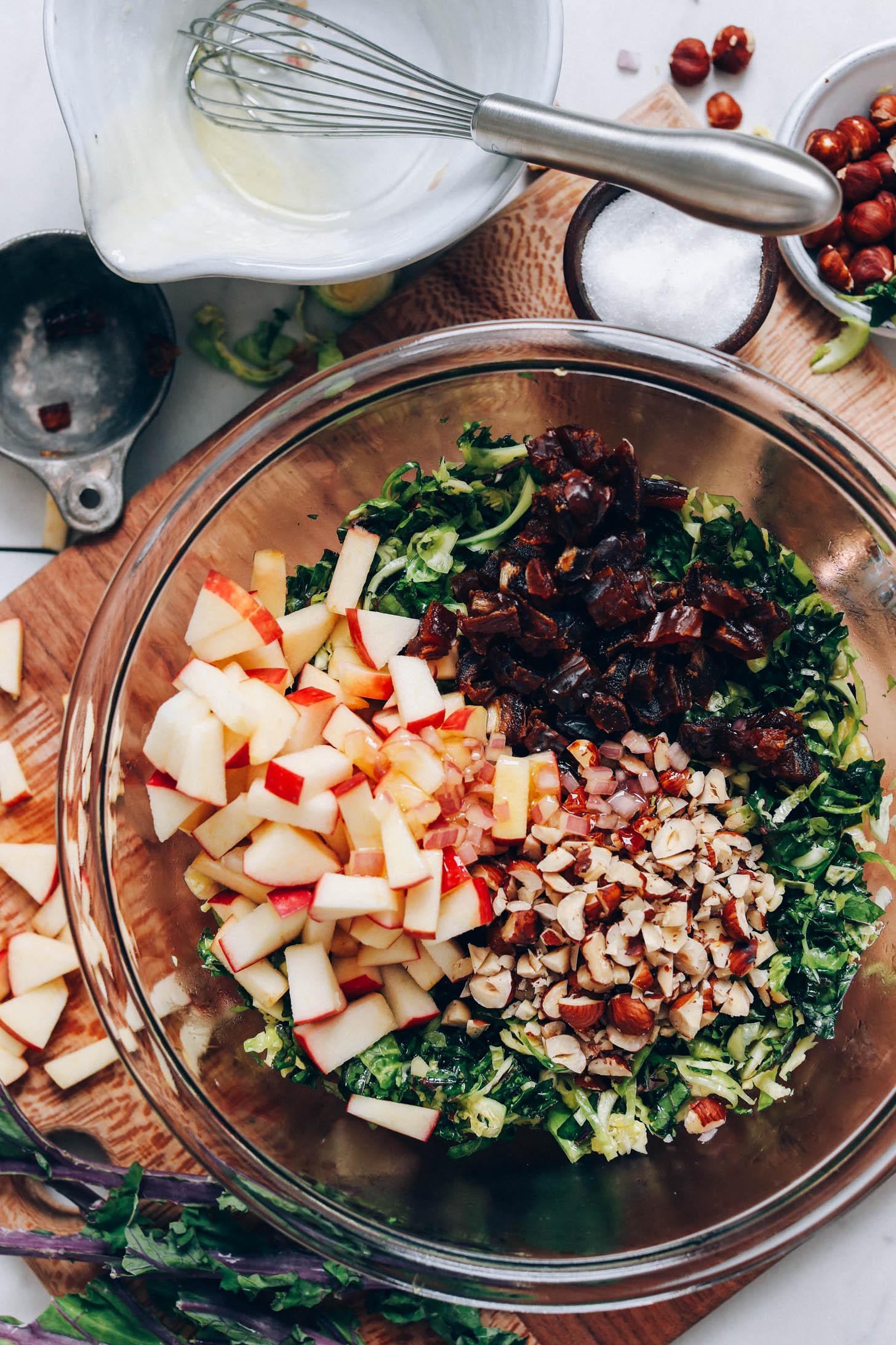 Chopped apples, dates, hazelnuts, and vinaigrette over shaved Brussels sprouts and kale
