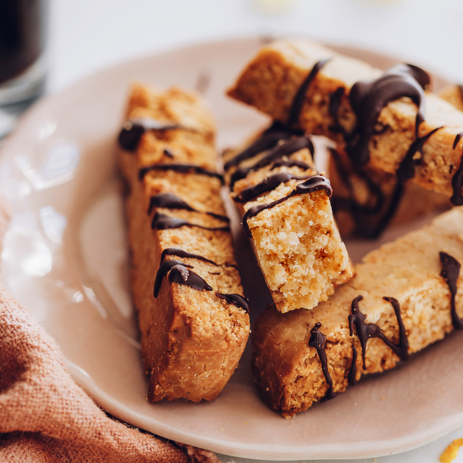 Plate of gluten-free ginger biscotti with chocolate drizzle