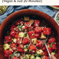 Bowl of vegan minty watermelon cucumber salad with vegan feta cheese