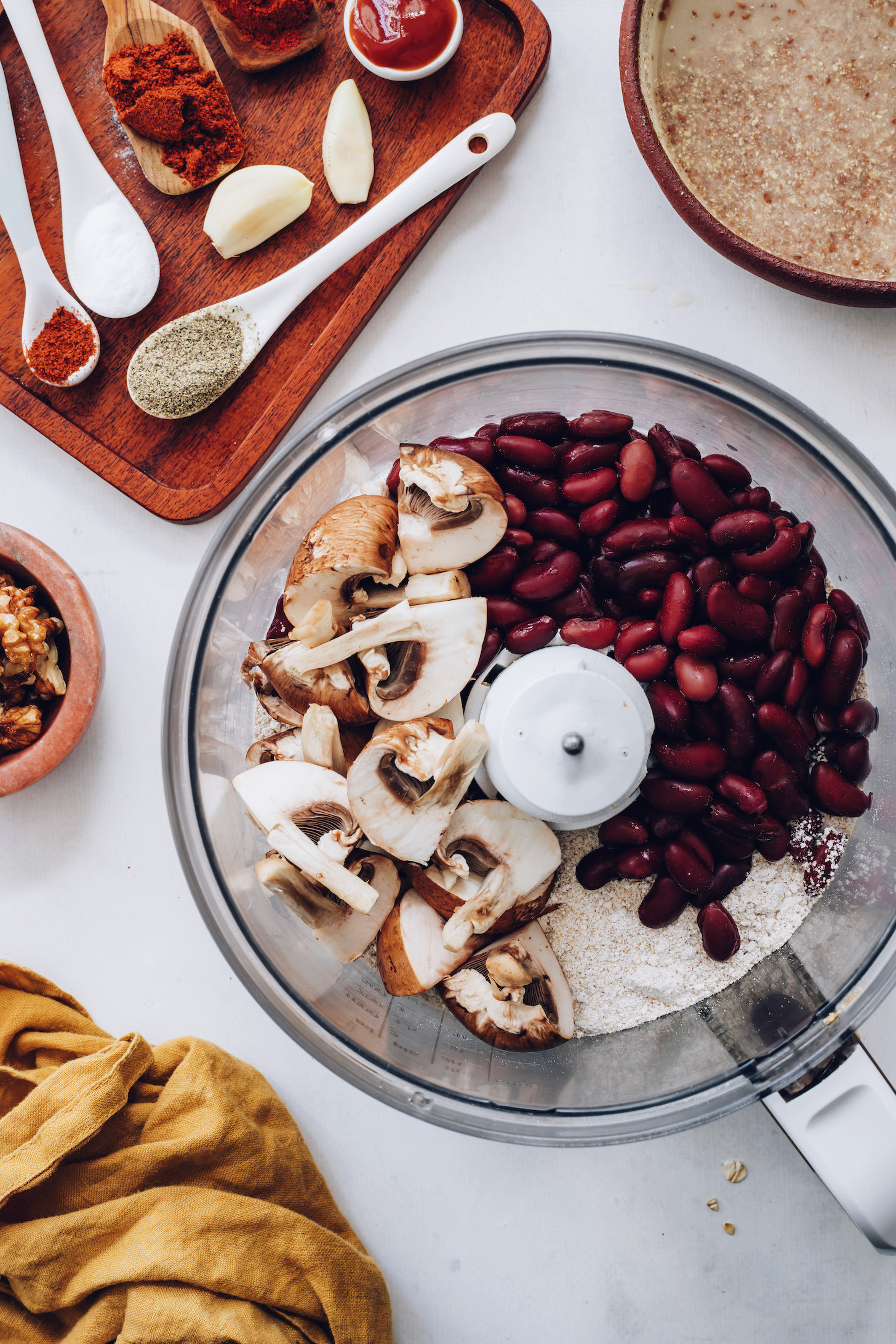 Mushrooms, kidney beans, and oats in a food processor