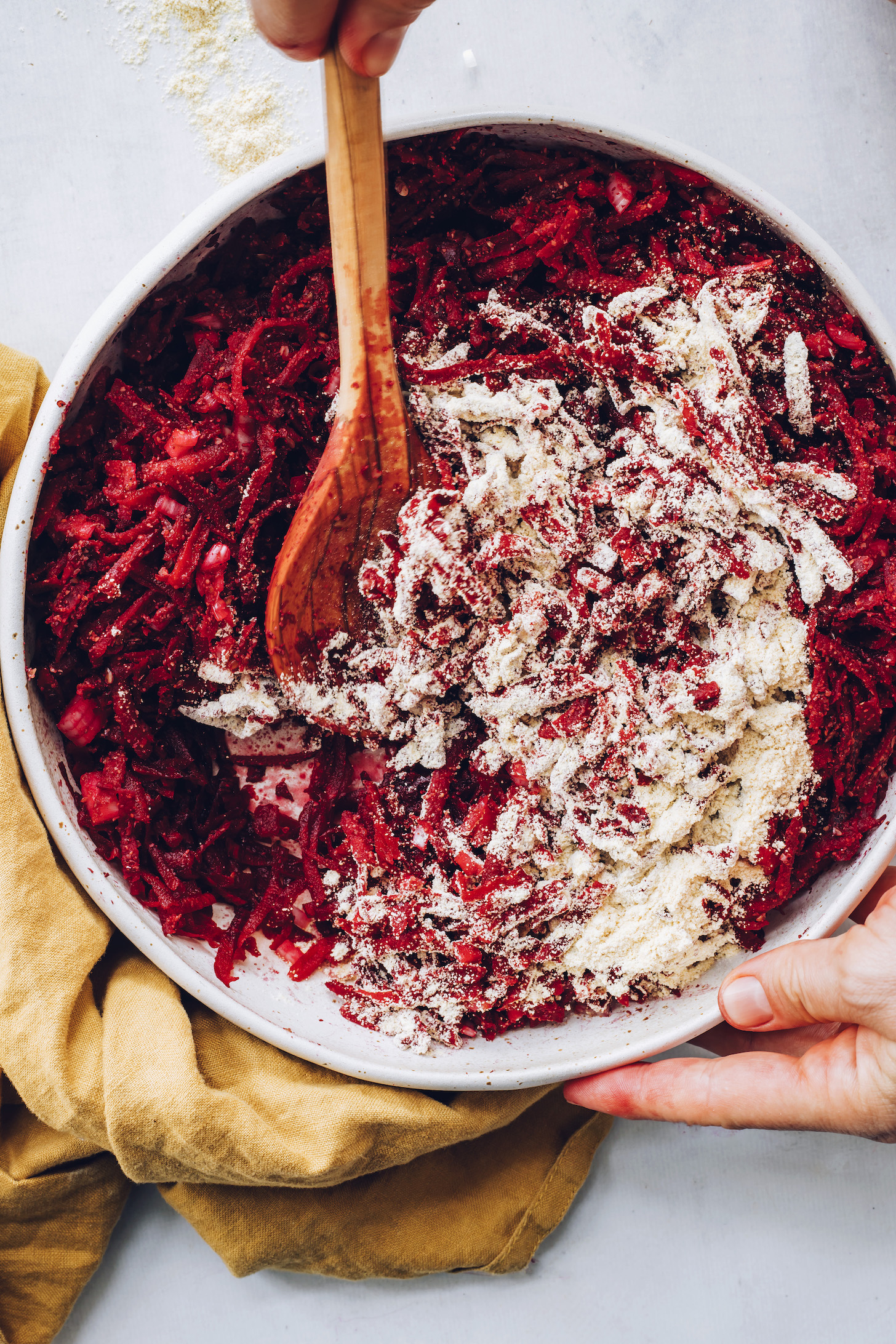 Stirring chickpea flour with shredded beets