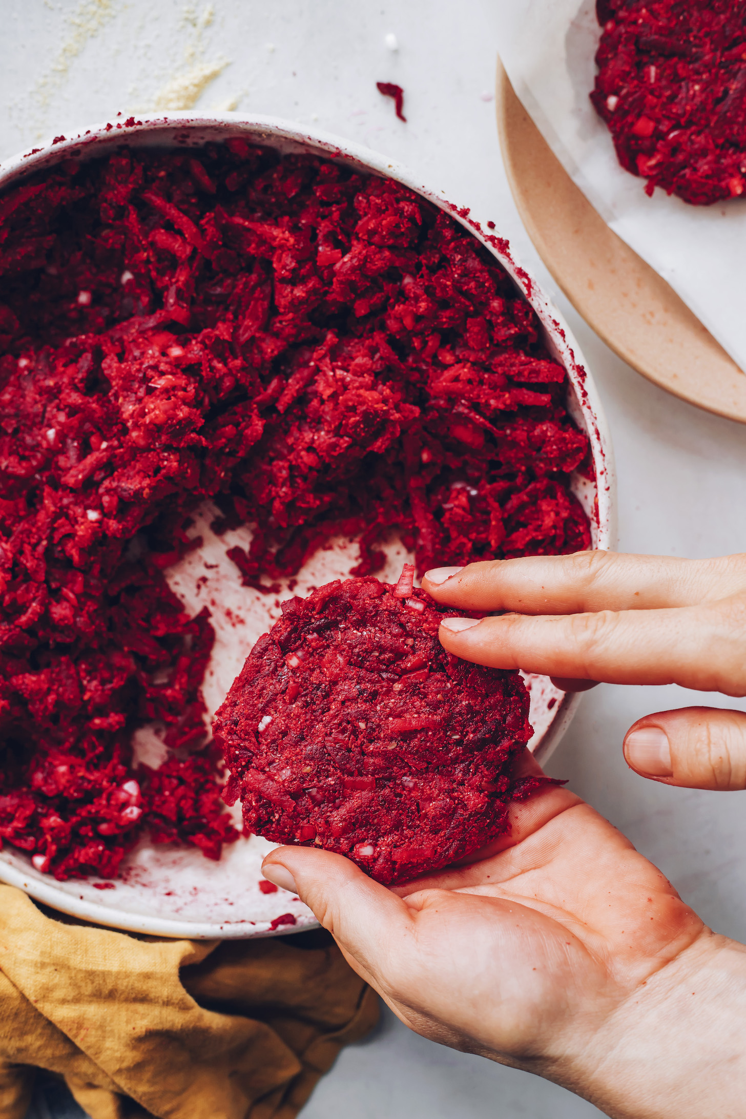 Forming beet fritter dough into patties