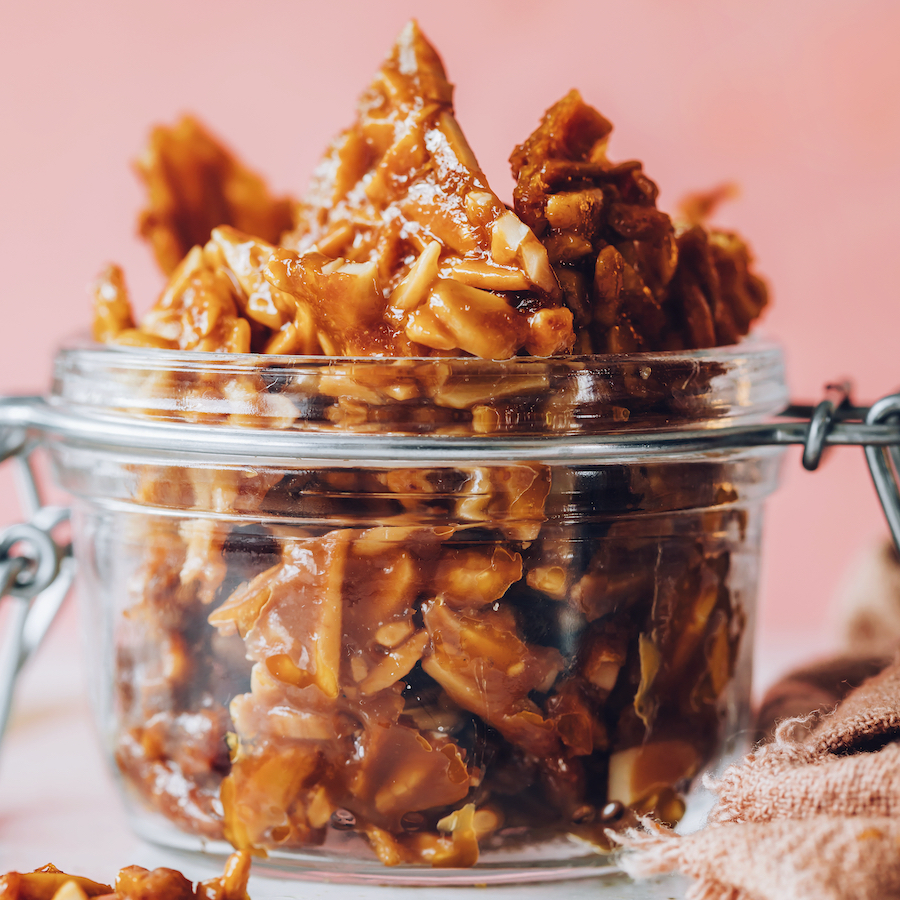 Pieces of almond brittle in a jar