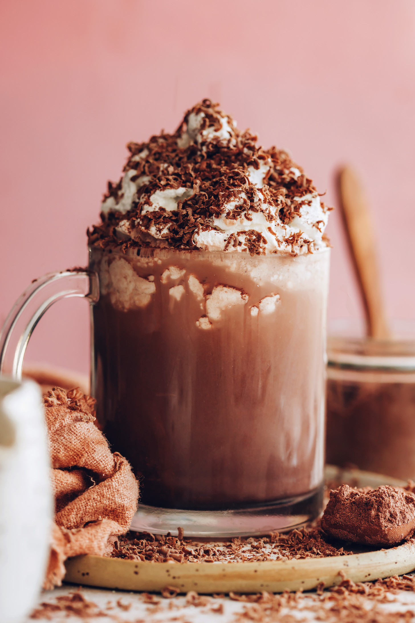 Mug of dairy-free hot chocolate topped with coconut whipped cream