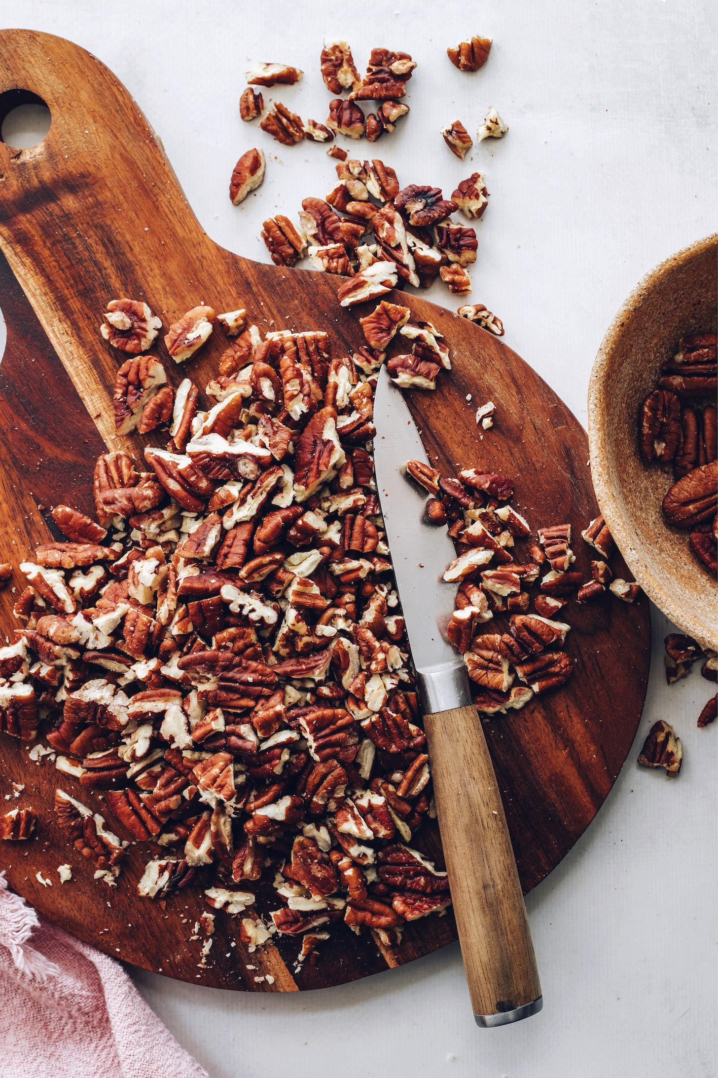 Chopped pecans on a cutting board